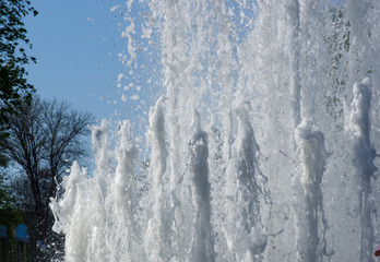 Fountain in city park on hot summer day