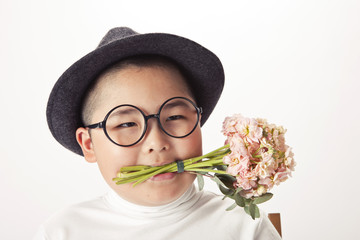 an asian fat boy wearing hat with flower isolated white.