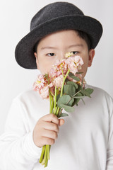 little boy hand hold a flower isolated white