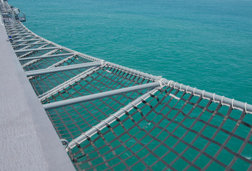 A mesh of battleship on nature background.A mesh is a barrier made of connected strands of metal, fiber, or other flexible or ductile materials.