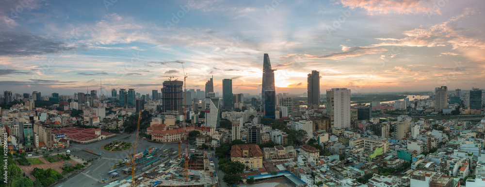 Wall mural Royalty high quality free stock image aerial view of Ho Chi Minh city, Vietnam. Beauty skyscrapers along river light smooth down urban development in Ho Chi Minh City, Vietnam.