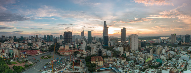 Royalty high quality free stock image aerial view of Ho Chi Minh city, Vietnam. Beauty skyscrapers along river light smooth down urban development in Ho Chi Minh City, Vietnam. - obrazy, fototapety, plakaty