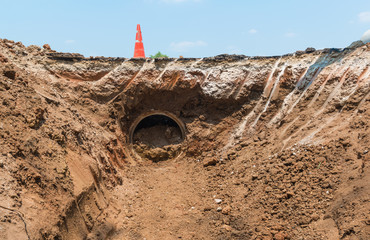 Row of Concrete Drainage Pipe on a Construction Site .Concrete pipe stacked sewage water system...