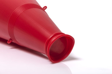 red plastic megaphone isolated white