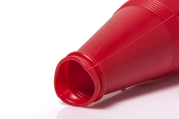 red plastic megaphone isolated white