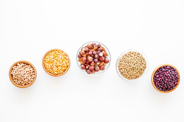Vegan protein source. Legumes and nuts on white background top view copy space
