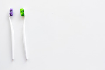 Clean teeth. Toothbrushes on white background top view copy space