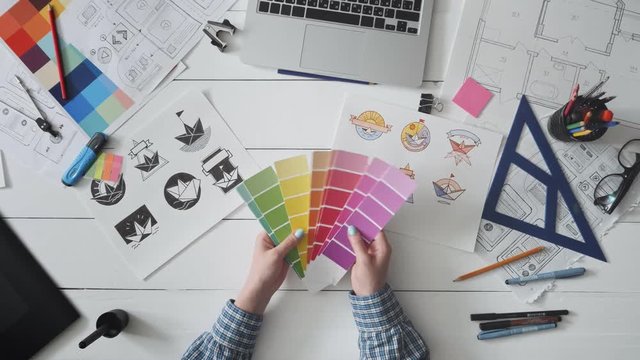 Creative designer choosing color palette for logo design