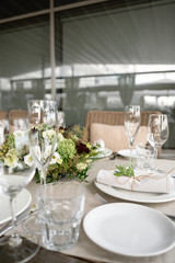 Wedding Banquet or gala dinner. The chairs and table for guests, served with cutlery and crockery....