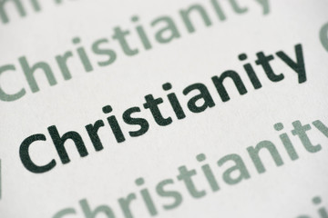 Fototapeta premium word Christianity printed on paper macro
