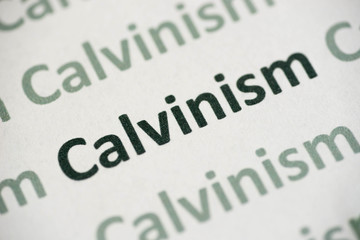 word Calvinism  printed on paper macro