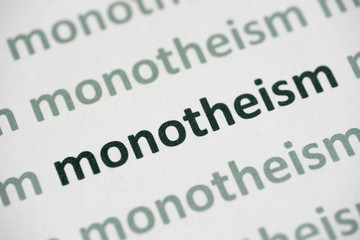 word monotheism printed on paper macro