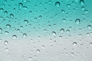 water drop. Water drops on glass surface as background. Drops of rain on glass. Sky rain day.