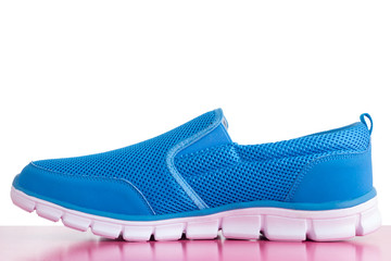Blue shoes on a pink background.