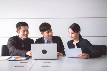 Business team meeting together to brainstrom.