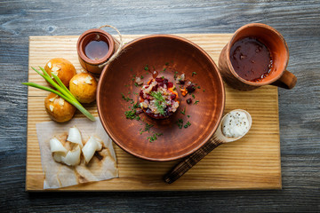 wooden table topped with plates of traditional ukrainian food