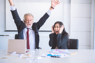 Business man ripping off paper.