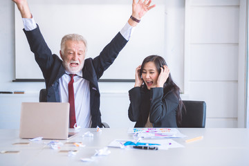 Business man ripping off paper.