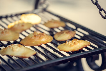 Baked sheep cheese on a grill grille. Polish regional sheep's cheese produced in the mountains.