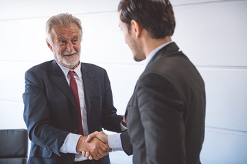 Businessman shake hand together.