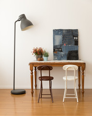 Interior decorated with design furniture, folding chair decorated with white color and brown color.