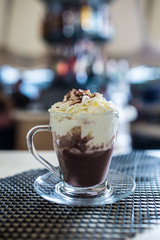 Cup with a hot chocolate and whipped cream.