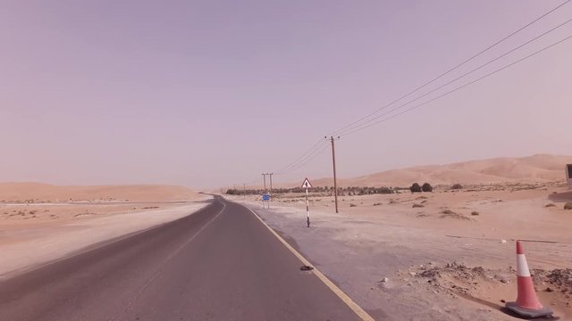 New road from Oasis Liwa to Moreeb Dune in Rub al Khali desert stock footage video