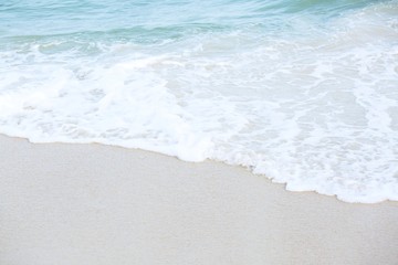 Blue ocean wave water distribution on sandy white beach, Sea amazing nature background.The color of...