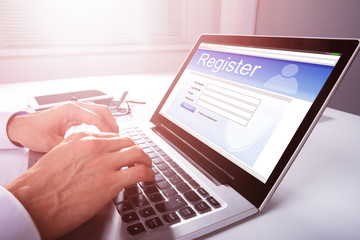 Businessman Filling Online Registration Form