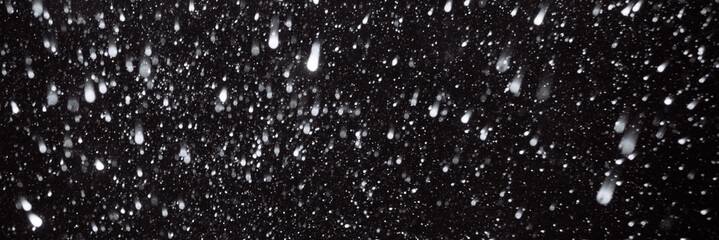 Real snow on black background