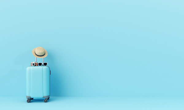 Blue suitcase with sun glasses, hat and camera on pastel blue background. travel concept minimal . 3d rendering 