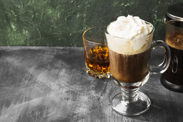 Irish coffee with whisky on dark background. Copy space. Food background