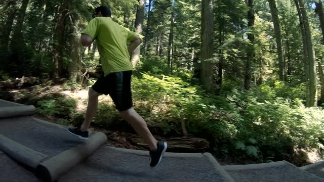 Man Jogging Dirt Forest Stairs Slow Motion