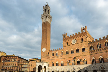 Obraz premium Mangia Tower and Palazzo Pubblico, located in Piazza del Campo, Siena, Italy