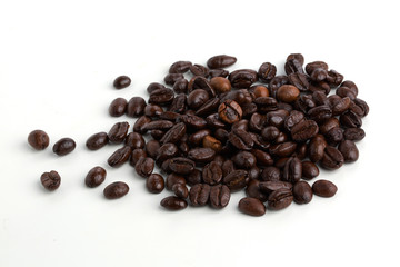 Roasted coffee beans isolated on pure white background for content using.