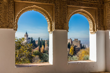 View of the Alhambra through a window at Generalife (Granada, Spain)