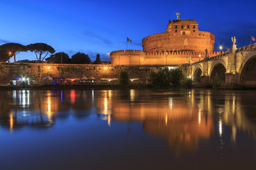 Castel Santangelo in Rome reflected on the Tiber River at sunset