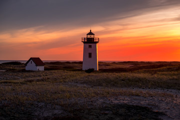 Fototapeta na wymiar Lighthouse by sunset