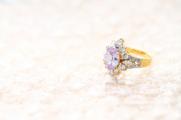 pink gemstone on diamond ring
