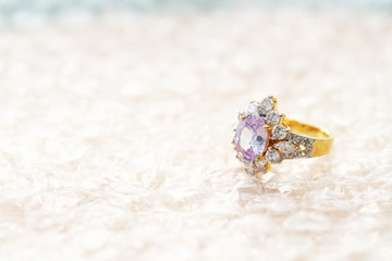 pink gemstone on diamond ring