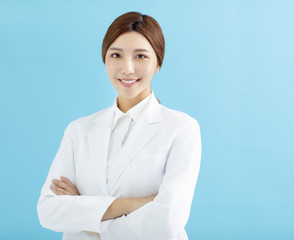 Smiling asian woman pharmacist doctor isolated.