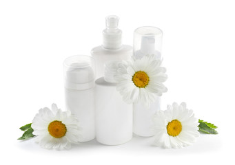 Composition with natural cosmetic and chamomile flowers on white background