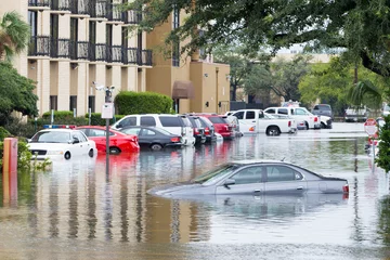 Foto op Aluminium Cars submerged  in Houston, Texas, US during hurricane Harvey. Water could enter the engine, transmission parts or other places. Disaster Motor Vehicle Insurance Claim Themed. Severe weather concept © michelmond