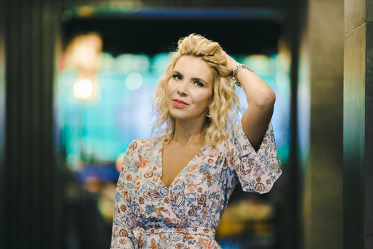 The beautiful girl stands in the hotel