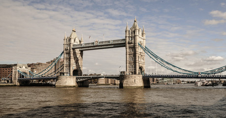 Fototapeta na wymiar View fo Tower Bridge along with River Thames on a sunny day with cloudy sky in London. 