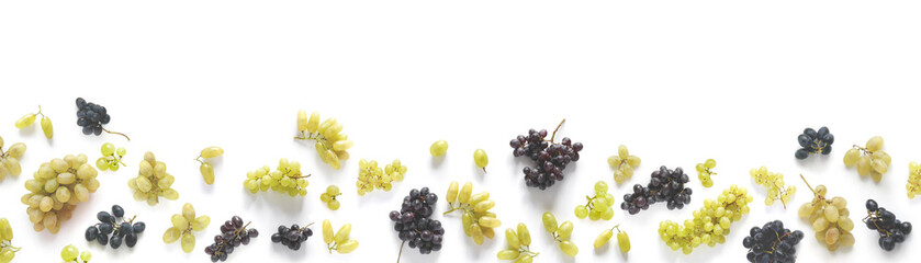 A banner made of black and green grapes isolated on a white background. The pattern of grapes of...