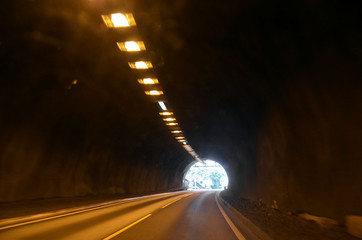 Blurred motion background of road tunnel in Norway
