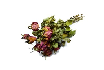 Top view of dried red rose and leaf on white background