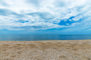 Fototapeta na wymiar On the beach with blue sky