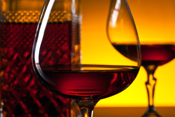  glasses of brandy on the reflective background